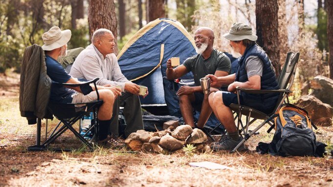 four-men-camping-in-woods.jpg