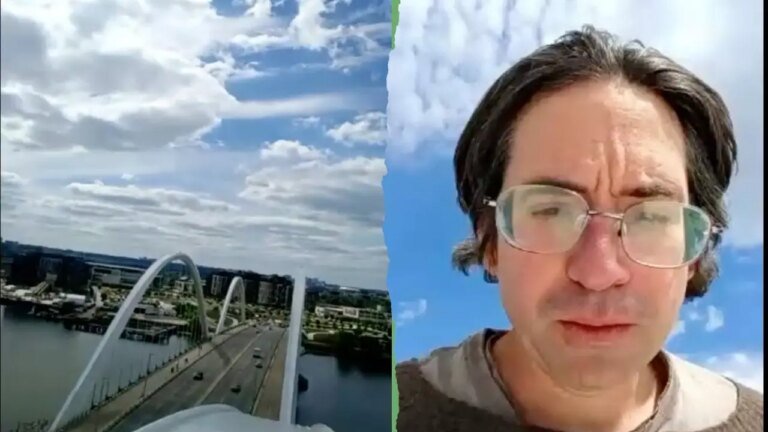 封鎖仍在繼續，一名男子站在華盛頓大橋上抗議伊朗戰爭和人工智慧。