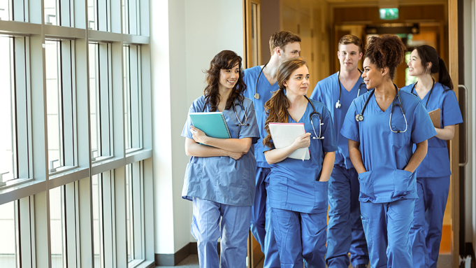 4e29efa0-a356-4e3f-9c2f-595b881462c6_medical-school-residents-walking.png