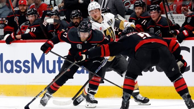 Carolina-Hurricanes-Nikolaj-Ehlers-27-and-Jalen-Chatfield-5-team-up-on-Vegas-Golden-Knights-Jack-Eic.jpeg