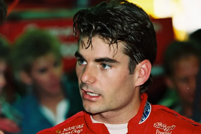 Jeff-Gordon-talks-to-his-crew-chief-prior-to-qualifying-for-a-1996-Winston-Cup-race-at-Charlotte-Mot.webp