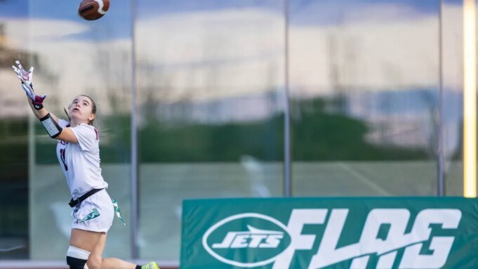 girl-reaches-catch-football-jets.jpg