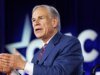 格雷格·阿博特 (Greg Abbott) 在與尼克斯隊打招呼後,發布了一張自己穿著馬刺球衣扣籃的人工智能照片,以惡搞凱西·霍赫爾 (Kathy Hochul)。