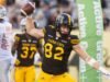 博·萊維·米切爾 (Bo Levi Mitchell) 傳出 5 次達陣,虎貓隊 (Tiger-Cats) 擊敗雄獅隊 (Lions)