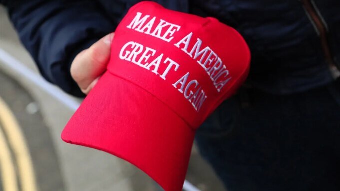 person-holds-MAGA-hat.jpeg